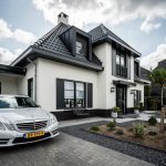 ThumbnailNotariswoning met moderne stijlelementen zoals strakke zinken dakkapellen