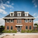 ThumbnailVoorgevel herenhuis met symmetrische opbouw en drie dakkappellen