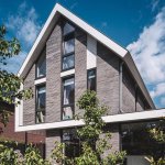 Thumbnail Achtergevel moderne schuurwoning met dak dat doorloopt in de veranda